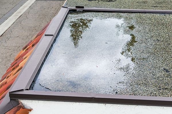ponding water on a flat roof 