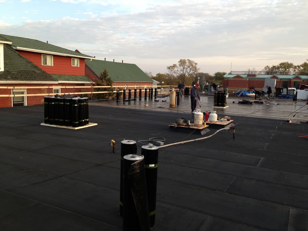 modified bitumen flat roof installation on hospital in port perry