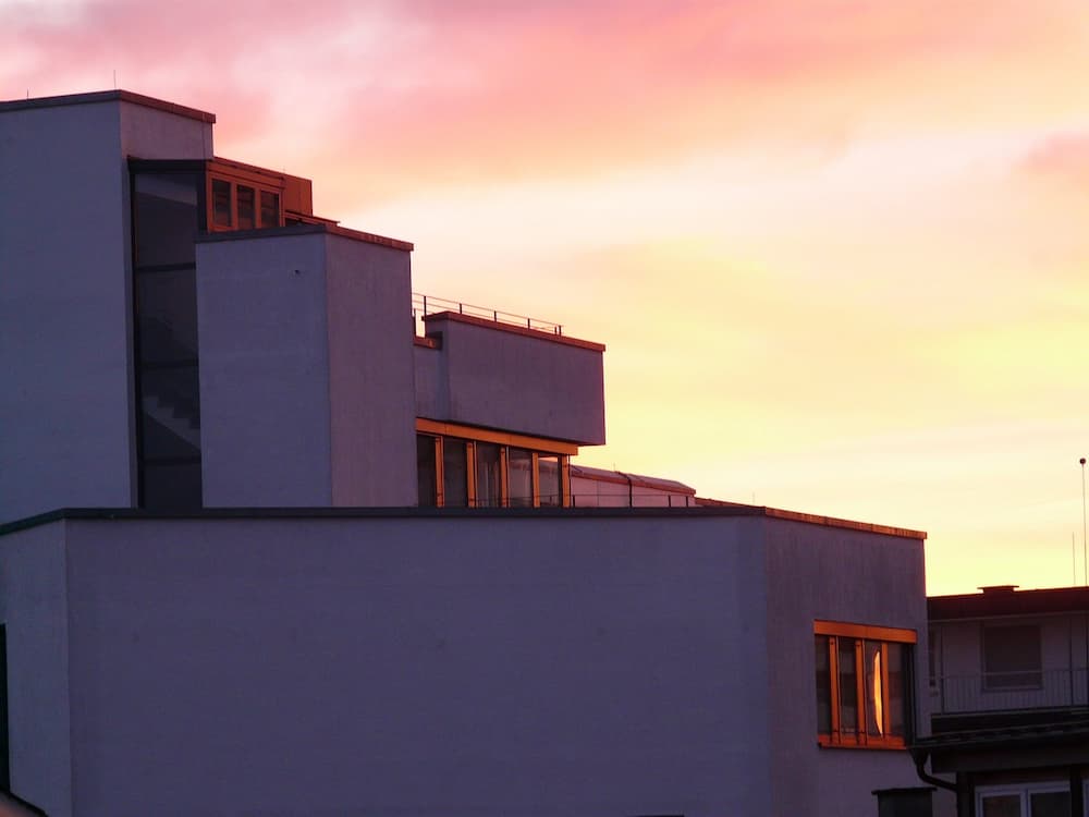 An apartment roof in the sunset