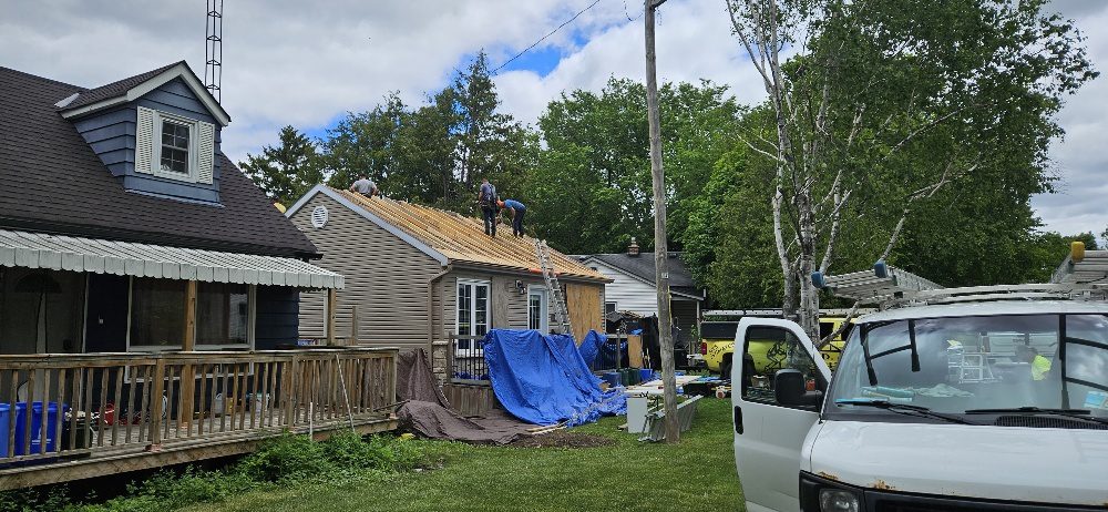C.D. Roofing crew re-roofing a wartime home in Ajax with the new plywood deck taking shape